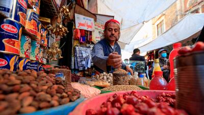 A Yemeni vendor waits for costumers in the old city market of the capital Sanaa ahead of the holy Muslim fasting month of Ramadan. AFP