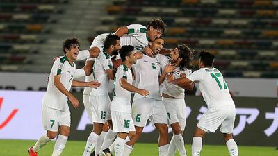 Ali Adnan Kadhim, No 6, of Iraq celebrates with teammates after scoring against Vietnam during their Asian Cup opener at Zayed Sports City Stadium in Abu Dhabi. Iraq won 3-2.