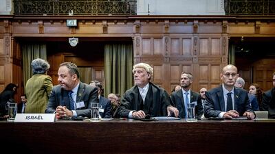 From left, Israeli Foreign Ministry adviser Tal Becker, lawyer Malcolm Shaw and Gilad Noam, deputy attorney general for international affairs, at the International Court of Justice in The Hague. AFP