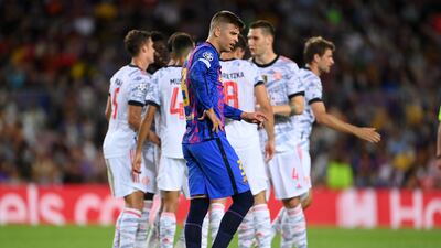 Barcelona's Gerard Pique looks dejected after Thomas Muller scored for Bayern Munich to make it 3-0 in the Champions League group-stage game at Camp Nou, on Tuesday, September 15. Getty
