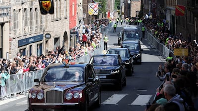 King Charles's motorcade drives along the Royal Mile to St Giles' Cathedral in the Scottish capital. Reuters