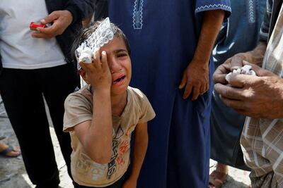 A Palestinian boy at the site of an Israeli air strike in Rafah in the Gaza Strip on October 17. Reuters