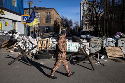A flag of Ukraine is displayed at a military check point in the centre of Kyiv. AFP