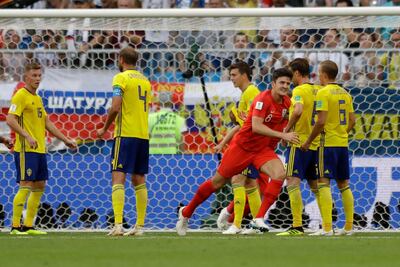 Harry Maguire celebrates scoring England's first goal. Matthias Schrader / AP Photo