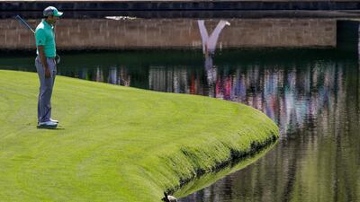 Sergio Garcia looks over the water on the 15th hole on Day 1 at the US Masters on Thursday. Garcia shot an 8-over 13 on the hole. David J Phillip / AP Photo