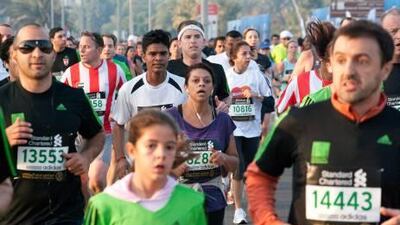 uge screens near the starting lines kept crowds updated on the runners' progress after the 7am start.