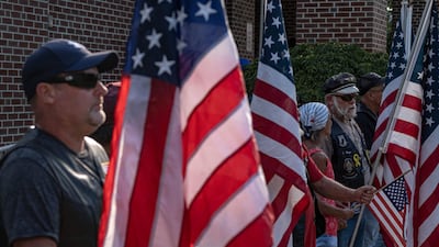 US Army veterans hold flags as they attend a vigil for Soviak at Edison Middle School in Berlin Heights, Ohio. AFP