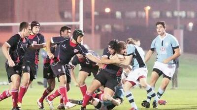 British School Al Khubairat, in pale blue, lost narrowly to Dubai College at Zayed Sports City. Jeffrey E Biteng / The National