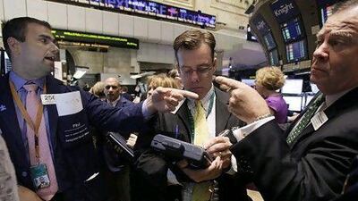 Traders on the floor of the New York Stock Exchange. AP Photo