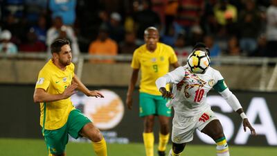 Senegal winger Sadio Mane, right, in action with South Africa's Dean Furman. Siphiwe Sibeko / Reuters