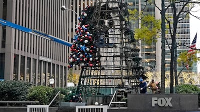 The artificial tree outside of the News Corp building caught fire shortly after midnight, police said. AP