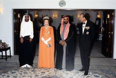 Queen Elizabeth ll and Prince Philip, the Duke of Edinburgh with Sheikh Zayed, the UAE's Founding Father on board the Royal Yacht Britannia during a state visit to the UAE on February 25, 1979. Anwar Hussein / Getty Images