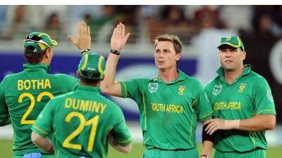 Dale Steyn, second from right, celebrates taking his only wicket in the fourth ODI.