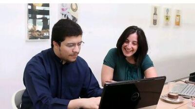 Ebrahim Malekzadeh, right, managing director of Esadore, works next to consultant Jacqui McCumiskey; shelves add ambience; Fida Tahboub, right, who runs Kharabeesh animation, works alongside Mohammad Ahmed Fikree, an animator.