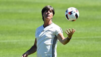 Germany coach Joachim Loew juggles a ball during a training session in Evian, France, 04 July 2016. Germany will face France in the Euro 2016 semi-finals match in Marseille on 07 July 2016. EPA/CHRISTIAN CHARISIUS