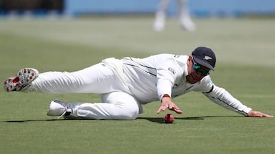 New Zealand’s Ross Taylor dives to stop the ball while fielding. AFP