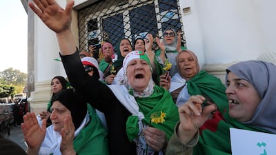 Algerians shout slogans as they march to mark the first anniversary of the popular protests in Algiers, Algeria. EPA