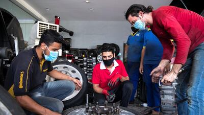 Epmloyees at Future Tyres Trading in Al Qouz, Dubai. Reem Mohammed / The National