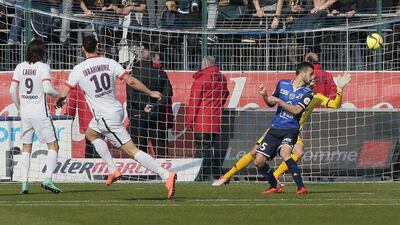 Paris Saint-Germain’s Swedish forward Zlatan Ibrahimovic (2nd L) scores a goal during the French Ligue 1 football match between Troyes and Paris Saint-Germain on March 13, 2016 at the Aube Stadium in Troyes. / AFP / JACQUES DEMARTHON