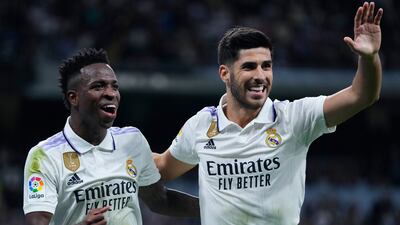 Marco Asensio, right, celebrates with Vinicius Junior after scoring Real Madrid's opening goal against Celta Vigo. AP