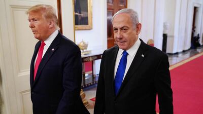 US President Donald Trump and Israeli Prime Minister Benjamin Netanyahu arrive for an announcement of Trump's Middle East peace plan in the East Room of the White House in Washington, DC on January 28, 2020. / AFP / MANDEL NGAN