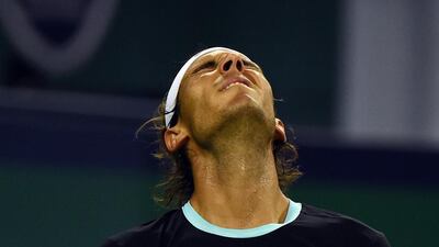 Rafael Nadal of Spain reacts after losing a point during his men's singles semi-final match against Jo-Wilfried Tsonga of France at the Shanghai Masters tennis tournament in Shanghai on October 17, 2015. AFP PHOTO / GREG BAKER