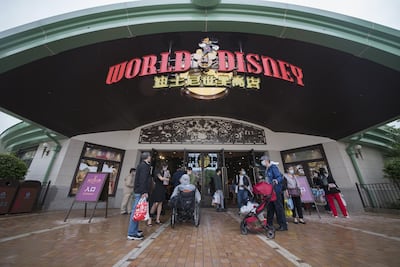 Tourists at Disneytown in Shanghai as Disneyland imposes social distancing measures on May 5. Getty