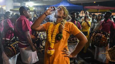 This picture taken on February 7, 2020 shows a Hindu devotee before making her way towards the Batu Caves temple to make offerings during the Thaipusam festival in Batu Caves on the outskirts of Kuala Lumpur. The Hindu festival of Thaipusam, which commemorates the day when Goddess Pavarthi gave her son Lord Muruga an invincible lance with which he destroyed evil demons, is celebrated by some two million ethnic Indians in Malaysia and Singapore. AFP