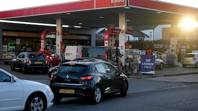Drivers queue for fuel at a petrol station in London on Wednesday morning amid the ongoing fuel crisis. Prime Minister Boris Johnson said disruption to the supply chain could continue for months. Photo: AP