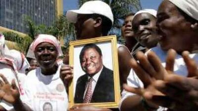 Supporters of Morgan Tsvangira sing and dance at the signing of the power-sharing deal, which ends months of anguished negotiations and gives the opposition control of cabinet and police.
