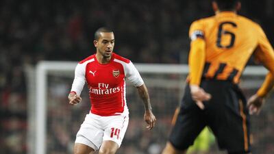 Arsenal’s Theo Walcott could make his first league start for a year after knee and groin injuries when his team meets Stoke City on Sunday. AFP PHOTO / IAN KINGTON
