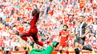 Newcastle goalkeeper Martin Dubravka spills the ball to allow Liverpool's Sadio Mane to score his second goal of the afternoon. AFP