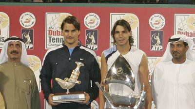 Rafael Nadal, centre right, and Roger Federer with their trophies after the 2006 Dubai Tennis Championships final. Photo: Dubai Duty Free Tennis Championships