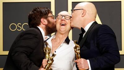 Jeff Reichert, Julia Reichert, and Steven Bognar pose in the press room with the Oscar for Best Documentary Feature for 'American Factory' at the 92nd Academy Awards on Sunday, February 9. AFP