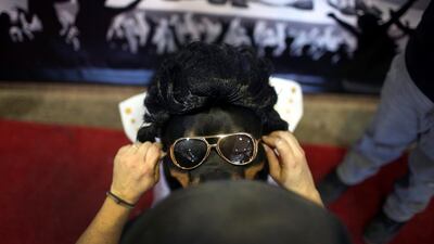 Talos the Rottweiler is clearly an Elvis Presley fan. Photo: AP