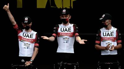 Tadej Pogacar, centre, and UAE Team Emirates teammates attend the team's presentation two days ahead of the 108th edition of the Tour de France. AFP