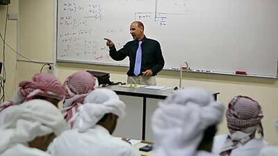 A teacher at Al Ittihad Model School leads students in a maths lesson.