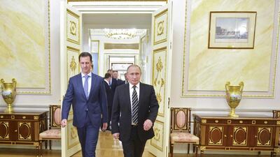 Mr Putin and Mr Al Assad enter a hall during a meeting at the Kremlin as the Syrian leader made a surprise visit to Moscow to thank Mr Putin for Russia’s military support in Syria. Alexei Druzhinin / RIA Novosti Kremlin/Reuters