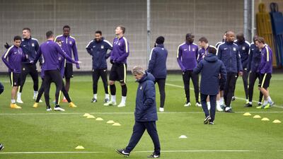 Manuel Pellegrini, centre, attends a Manchester City’s training session. Oli Scarff / AFP