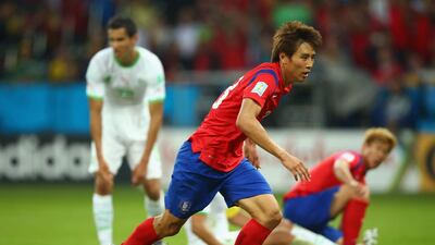 Koo Ja-Cheol of South Korea reacts after scoring his team's second goal in their 4-2 loss to Algeria on Sunday at the 2014 World Cup. Paul Gilham / Getty Images