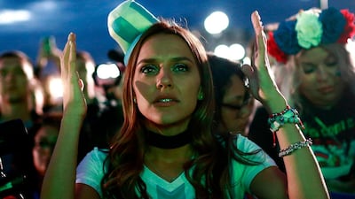 TOPSHOT - An Argentina fan at the Fan Zone in Kazan reacts as she watches a live broadcast of the Russia 2018 World Cup football match between Argentina and Croatia. Benjamin Cremel / AFP