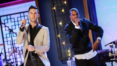 Adam Levine of Maroon 5, left, and Kanye West perform onstage in New York City. Scott Gries / Getty Images / AFP