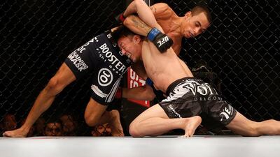 Tatsuya Kawajiri, right, says he considers the takedown the most important part of MMA. Josh Hedges / Getty Images