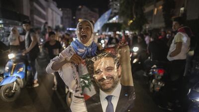 Supporters of former Lebanese prime minister Saad Hariri gather in Tariq El Jdideh in Beirut, in October last year. Getty Images