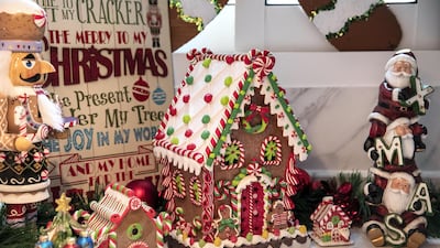 Gingerbread houses, Nutcracker figurines and several Santas vie for attention in the kitchen