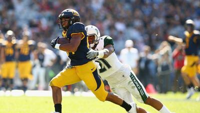 Khalfani Muhammad of the California Golden Bears runs the ball during the American college football game in Sydney. Mark Nolan / Getty Images