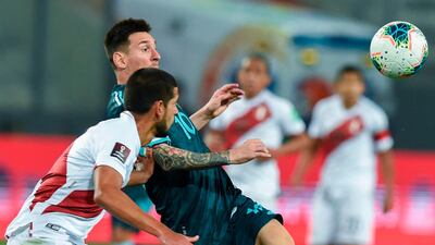 Peru's Miguel Trauco, left, and Argentina's Lionel Messi vie for the ball. AFP