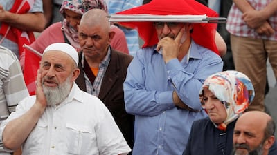 Supporters of the AK Party wait for mayoral candidate Binali Yildirim to arrive at an election rally on June 21, 2019. Reuters