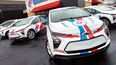 A closer look at a Chevy Bolt EV with Domino's branding.