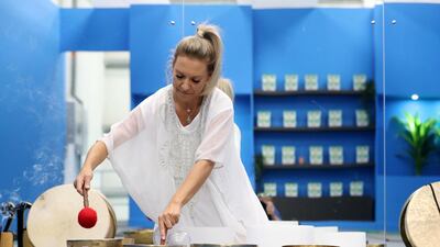 Ms Roux demonstrates sound therapy at the Dubai event.